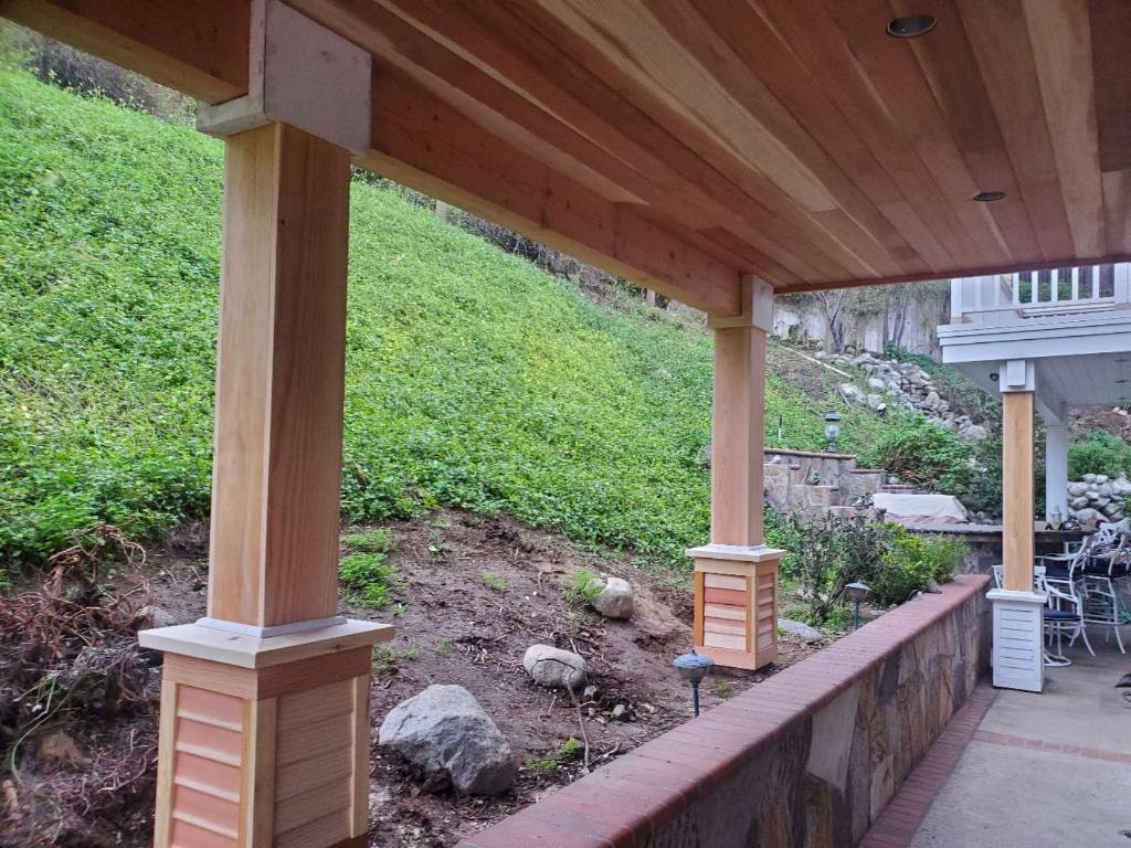 New cedar columns and patio cover framing in progress — Orange County CA