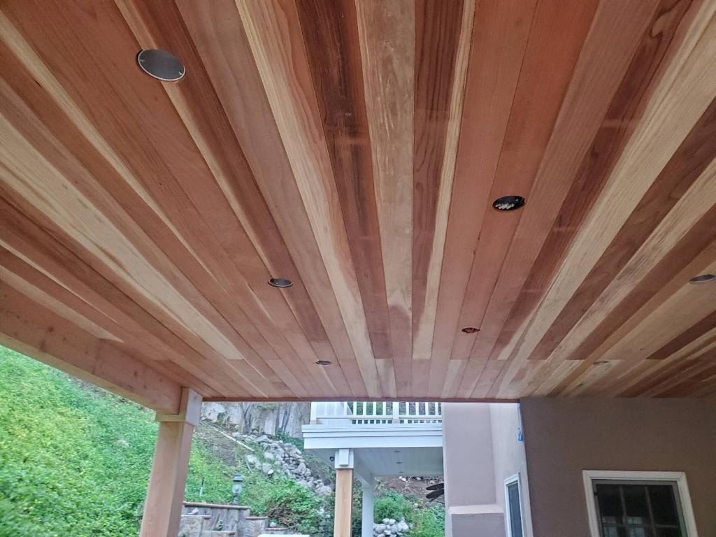 Finished cedar tongue-and-groove ceiling with recessed lighting installed — Orange County CA